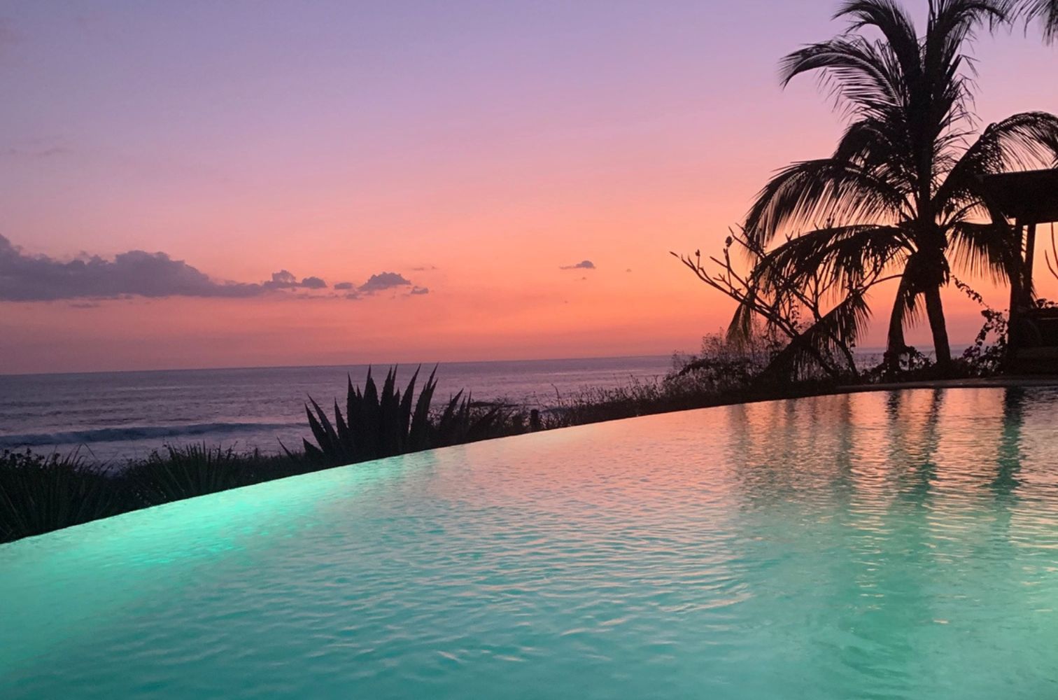 Sunset over the infinity pool at Villa Floramar, Costa Rica.